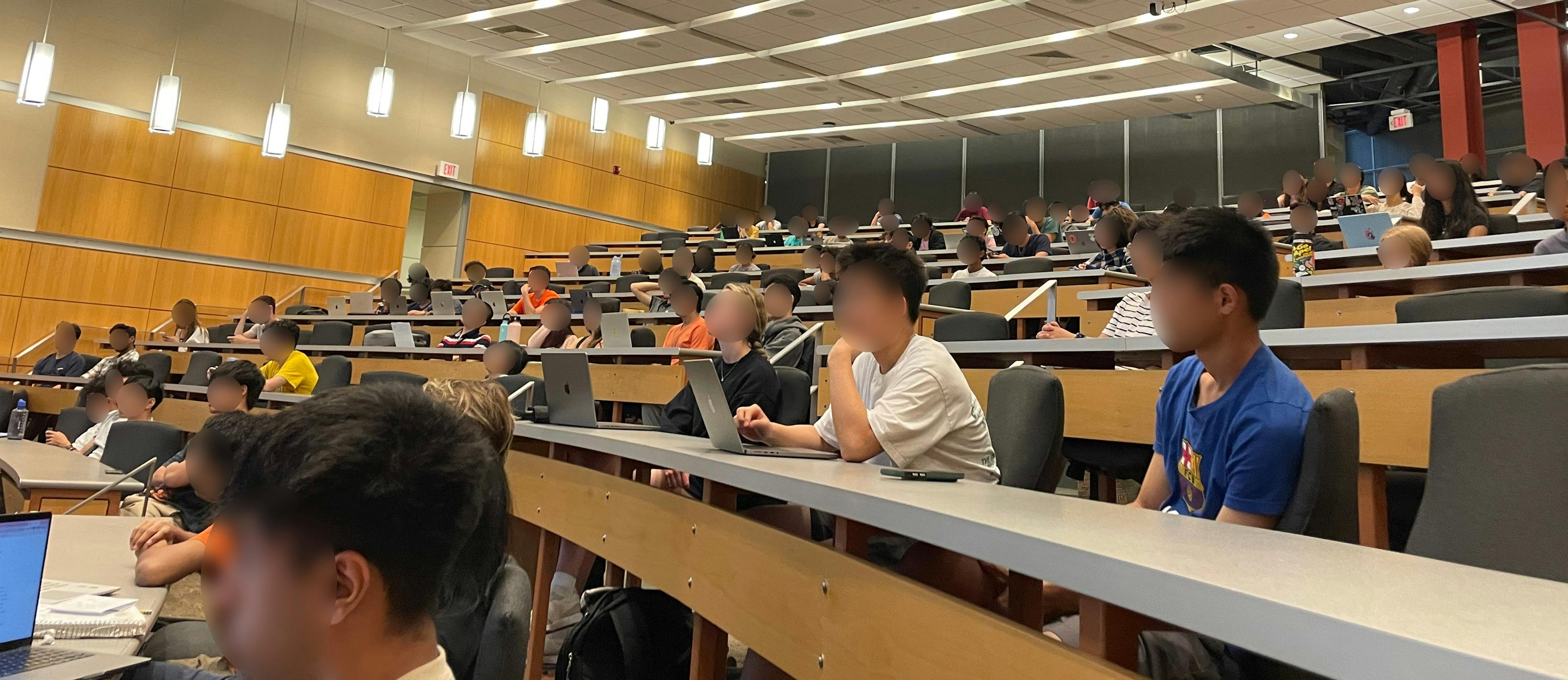 Students in a Project: Code meeting in a lecture hall